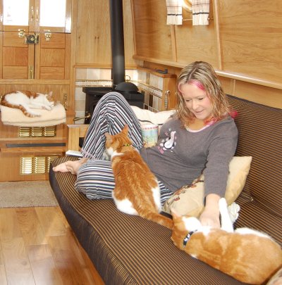 Wendy tickles Dick, our marmalade kitten